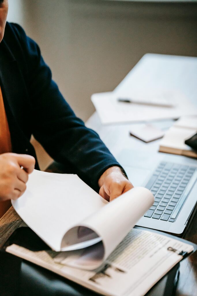 Photo Of Person Flipping Pages